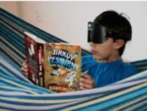 Boy reading blindfolded